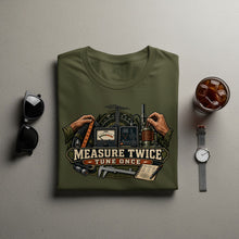 Load image into Gallery viewer, Olive green t-shirt with graphic and text "MEASURE TWICE TUNE ONCE."
