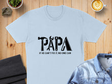 Load image into Gallery viewer, Light blue t-shirt with "PAPA" in tool graphics and text "IF HE CAN'T FIX IT, NO ONE CAN."
