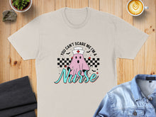 Load image into Gallery viewer, T-shirt with ghost saying "You can't scare me I'm a Nurse."
