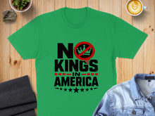 Load image into Gallery viewer, Green t-shirt with "NO KINGS IN AMERICA" text and star design.
