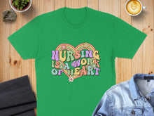 Load image into Gallery viewer, Green t-shirt with "NURSING IS A WORK OF HEART" in colorful groovy text.
