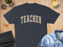 Load image into Gallery viewer, Dark t-shirt with "Teacher" text in floral pattern.
