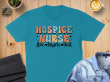 Load image into Gallery viewer, Teal t-shirt with "Hospice Nurse Love Inspire Heal" in colorful retro text.
