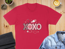 Load image into Gallery viewer, Red t-shirt with XOXO graphic, stethoscope, and medical icons.
