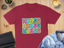 Load image into Gallery viewer, Burgundy t-shirt with "NURSE" in colorful bubbly letters.
