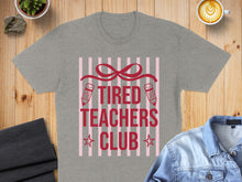 Load image into Gallery viewer, Grey t-shirt with "TIRED TEACHERS CLUB" text and pencil graphics.
