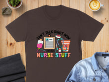 Load image into Gallery viewer, Brown t-shirt with "Can't Talk Right Now Doing Nurse Stuff" graphic.
