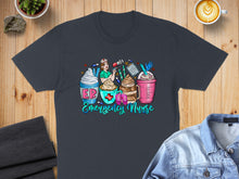 Load image into Gallery viewer, Dark t-shirt with "Emergency Nurse" text and four coffee drinks with nurse motifs.
