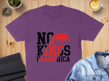 Load image into Gallery viewer, Purple t-shirt with "NO KINGS IN AMERICA" text and crown graphic.
