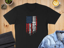 Load image into Gallery viewer, Black t-shirt with American flag design made of rifles and pistols.
