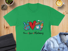 Load image into Gallery viewer, Green t-shirt with peace sign, heart, pills, and "Peace love Pharmacy" text.
