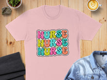 Load image into Gallery viewer, Pink t-shirt with "Nurse" repeated in colorful bubble letters.
