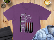 Load image into Gallery viewer, Purple t-shirt with "We the People" and distressed American flag graphic.
