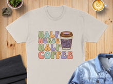 Load image into Gallery viewer, Cream t-shirt with "Half Nurse Half Coffee" text and coffee cup graphic.
