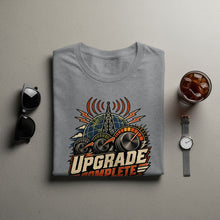 Load image into Gallery viewer, Grey t-shirt with a graphic featuring a globe, radio tower, and speedometers with "Upgrade Complete" text.
