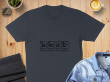 Load image into Gallery viewer, Dark t-shirt with "Teacher" spelled with periodic table elements: Te, Ac, H, Er.
