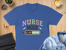 Load image into Gallery viewer, Blue t-shirt with "Nurse Mode All Day Every Day" text and band-aids.
