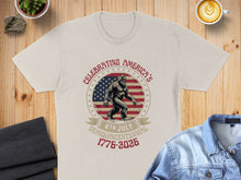 Load image into Gallery viewer, Cream t-shirt with Bigfoot graphic and "Celebrating America's 4th of July Semiquincentennial 1776-2026".
