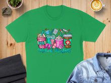 Load image into Gallery viewer, Green t-shirt with "MA Medical Assistant" and medical icons on drinks.
