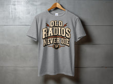 Load image into Gallery viewer, Grey t-shirt with text "OLD RADIOS NEVER DIE" and a vintage radio dial graphic.
