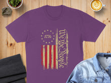 Load image into Gallery viewer, Purple t-shirt with distressed US flag and "We the People" text.
