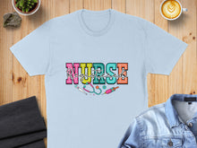 Load image into Gallery viewer, Light blue t-shirt with "Registered NURSE" text and stethoscope.
