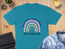 Load image into Gallery viewer, Turquoise t-shirt with rainbow and stethoscope graphic, text "This is What An Awesome Pediatric Nurse Looks Like".
