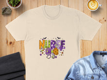 Load image into Gallery viewer, Cream t-shirt with colorful "Nurse" text and Halloween graphics.
