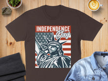 Load image into Gallery viewer, Brown t-shirt with Statue of Liberty and US flag graphic, text "INDEPENDENCE Day".
