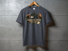 Load image into Gallery viewer, Dark gray t-shirt with "Measure Twice Tune Once" graphic featuring radio equipment and tools.
