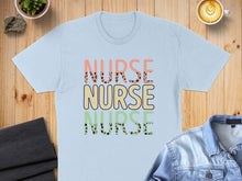 Load image into Gallery viewer, Light blue t-shirt with "NURSE" text in colorful, textured letters.
