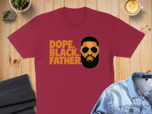 Load image into Gallery viewer, Burgundy t-shirt with "Dope. Black. Father." text and a man's portrait.

