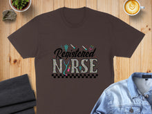 Load image into Gallery viewer, Brown t-shirt with "Registered Nurse" in colorful, patterned lettering.
