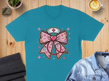 Load image into Gallery viewer, Teal t-shirt with a pink nurse's bow featuring hearts, stethoscope, and nurse's cap.
