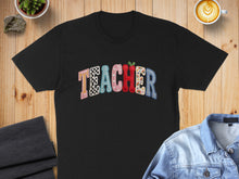 Load image into Gallery viewer, Black t-shirt with "Teacher" in colorful, patterned lettering.
