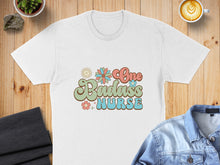 Load image into Gallery viewer, White t-shirt with retro "One Badass Nurse" graphic and floral accents.

