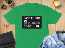 Load image into Gallery viewer, Green t-shirt with "BANK OF DAD" credit card design.
