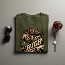 Load image into Gallery viewer, Olive green t-shirt with "Low Power. High Expectations" graphic.
