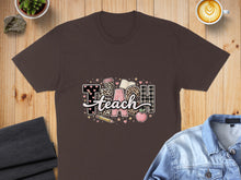 Load image into Gallery viewer, Brown t-shirt with "TEACH" graphic featuring books, apple, pencil, and leopard print.
