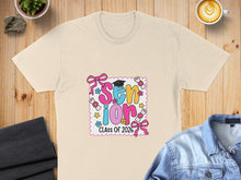 Load image into Gallery viewer, Cream t-shirt with "Senior Class of 2026" text and graduation icons.

