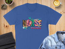Load image into Gallery viewer, Blue t-shirt with "Nurse in progress" text and medical graphics.
