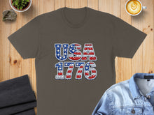 Load image into Gallery viewer, T-shirt with "USA 1776" in patriotic red, white, and blue lettering.
