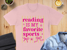 Load image into Gallery viewer, Pink t-shirt with "Reading is my favorite sports" text and decorative bows.
