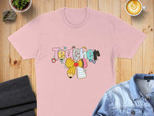 Load image into Gallery viewer, Pink t-shirt with "Teacher" text and school-themed graphics.
