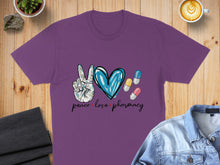 Load image into Gallery viewer, Purple t-shirt with peace sign, heart, and pharmacy pills.
