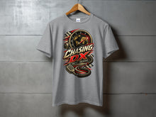 Load image into Gallery viewer, Gray t-shirt with "Chasing DX" graphic featuring a speedometer, globe, and microphone.
