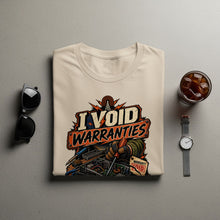Load image into Gallery viewer, Cream t-shirt with "I VOID WARRANTIES" graphic featuring electronics repair.
