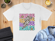 Load image into Gallery viewer, White t-shirt with "NURSE" text in colorful, retro font and lightning bolts.
