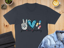 Load image into Gallery viewer, Dark grey t-shirt with peace sign, heart, and pharmacy pills graphic.
