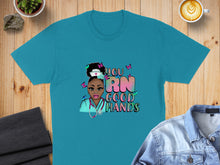 Load image into Gallery viewer, Teal t-shirt with nurse illustration and "you RN GOOD HANDS" text.
